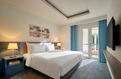 Tweepersoonskamer met balkon — M Village Hotel Thợ Nhuộm, a brand of Modern Village Lifestyle